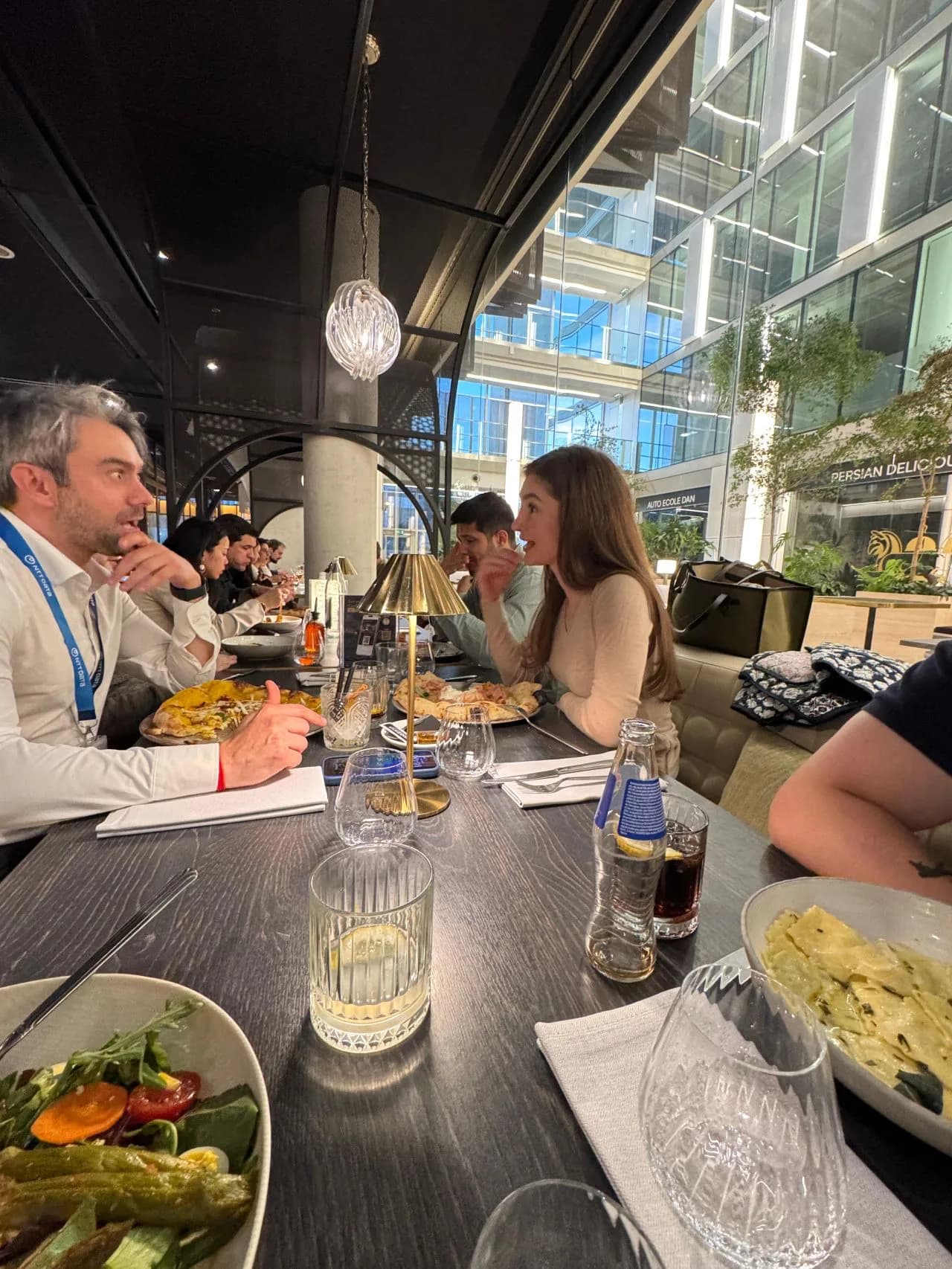 Members around a long table at an AI and Dinner event