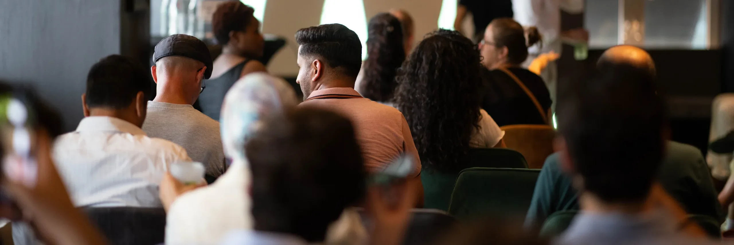 The audience watching a talk at an AI and Coffee All-in event